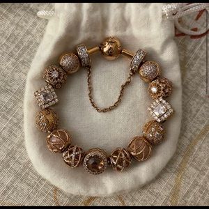 Pandora rose gold bracelet with charms